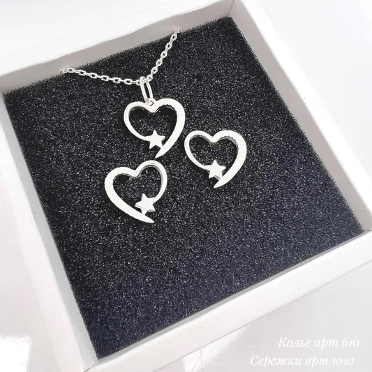 Silver necklace with heart-shaped pendants in a black box