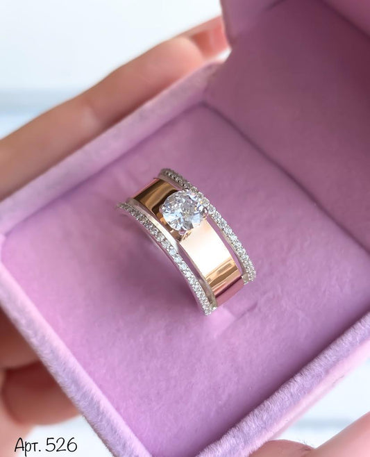 Rose gold ring with a diamond on a pink cushion